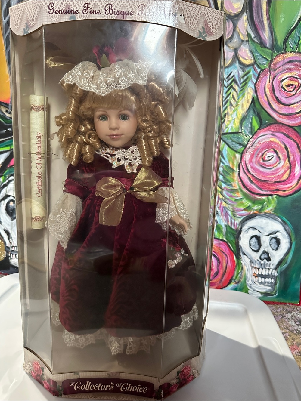 Collector’s Choice Burgundy Porcelain Doll with Gold Bow